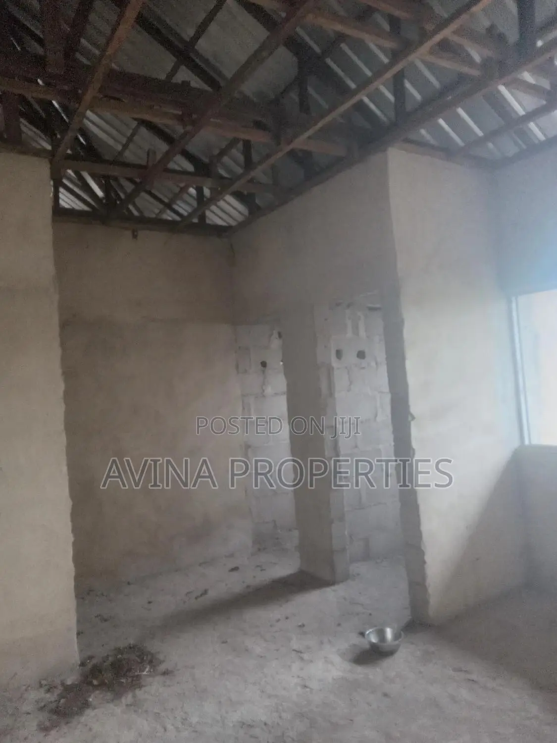 A Storey Building of 14 Room's to Converterble Flats 85% in Owerri