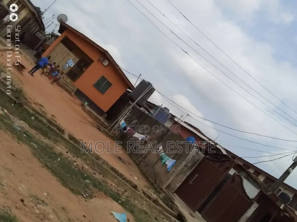 Half Plot of Land by Kwara Bustop Fenced in Alimosho