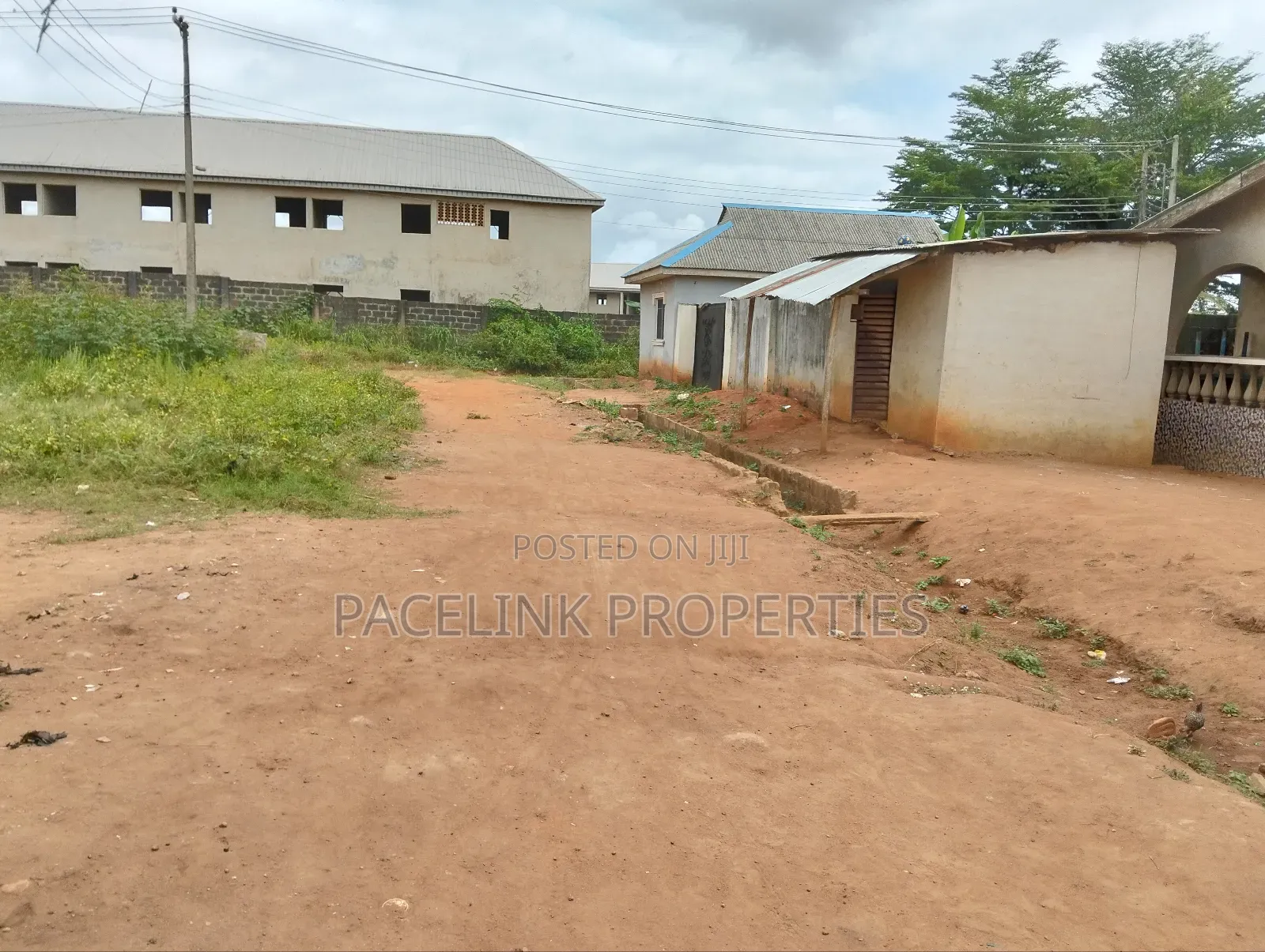 Half Plot of Land With Two Shops in Ayobo