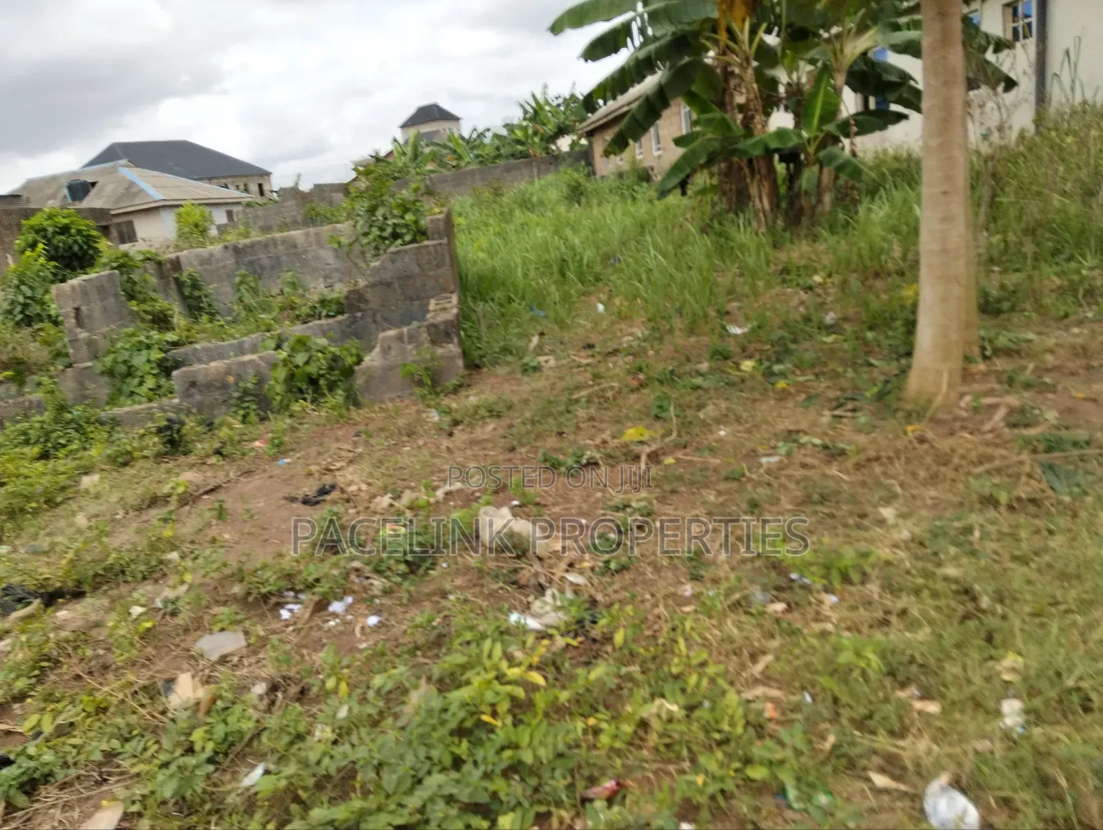 Half Plot of Land With Two Shops in Ayobo