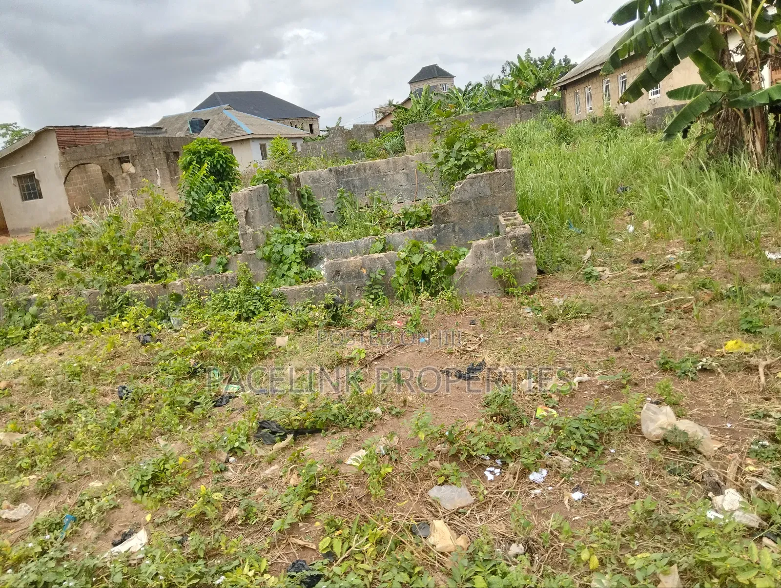 Half Plot of Land With Two Shops in Ayobo