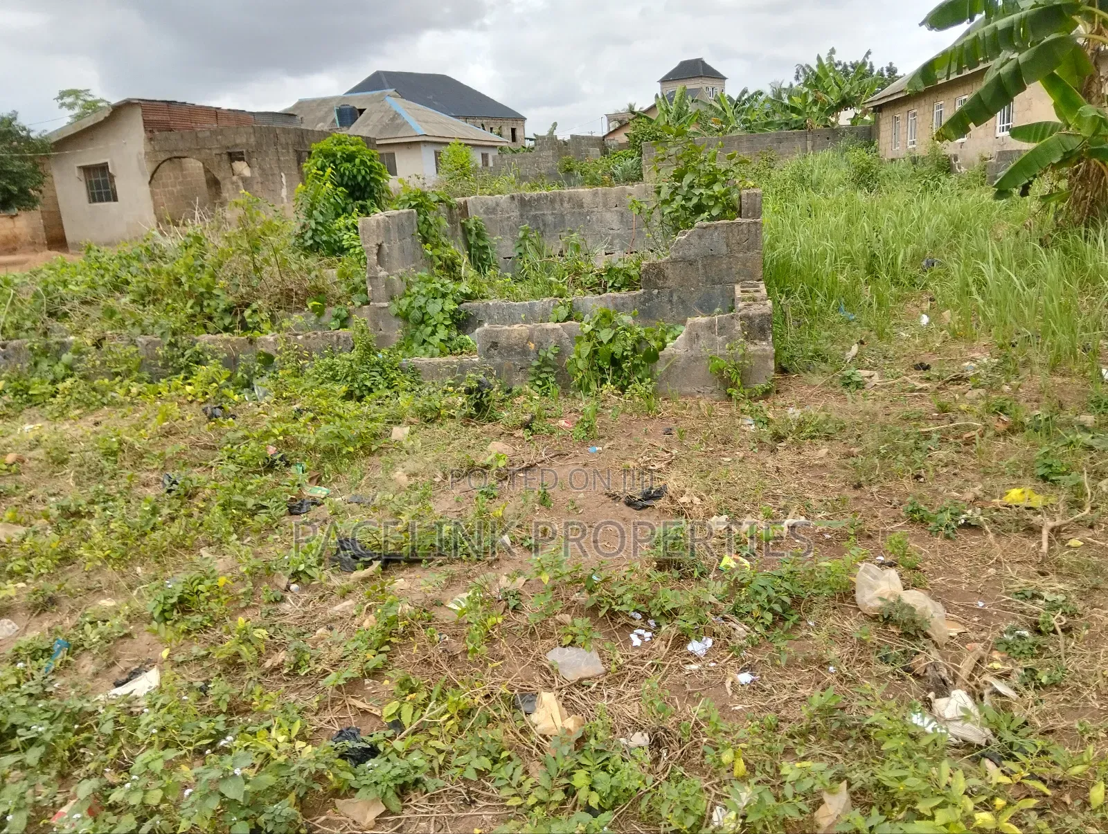 Half Plot of Land With Two Shops in Ayobo
