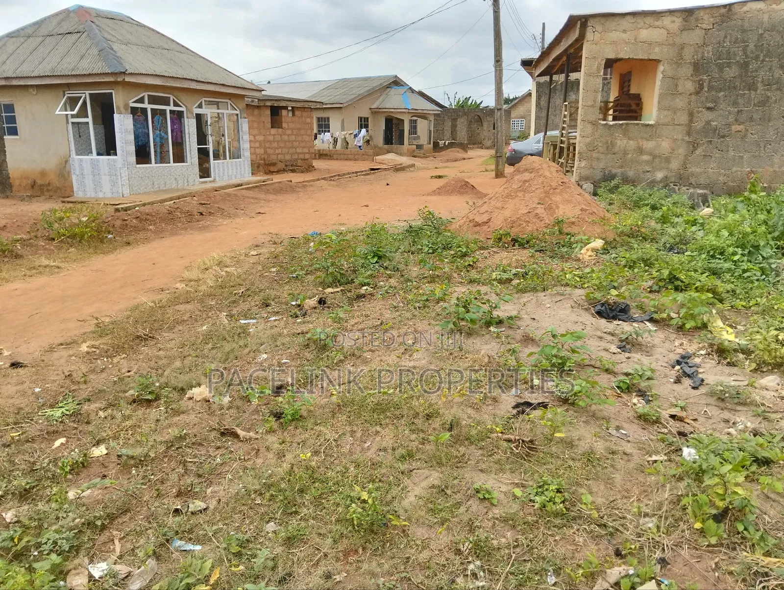 Half Plot of Land With Two Shops in Ayobo