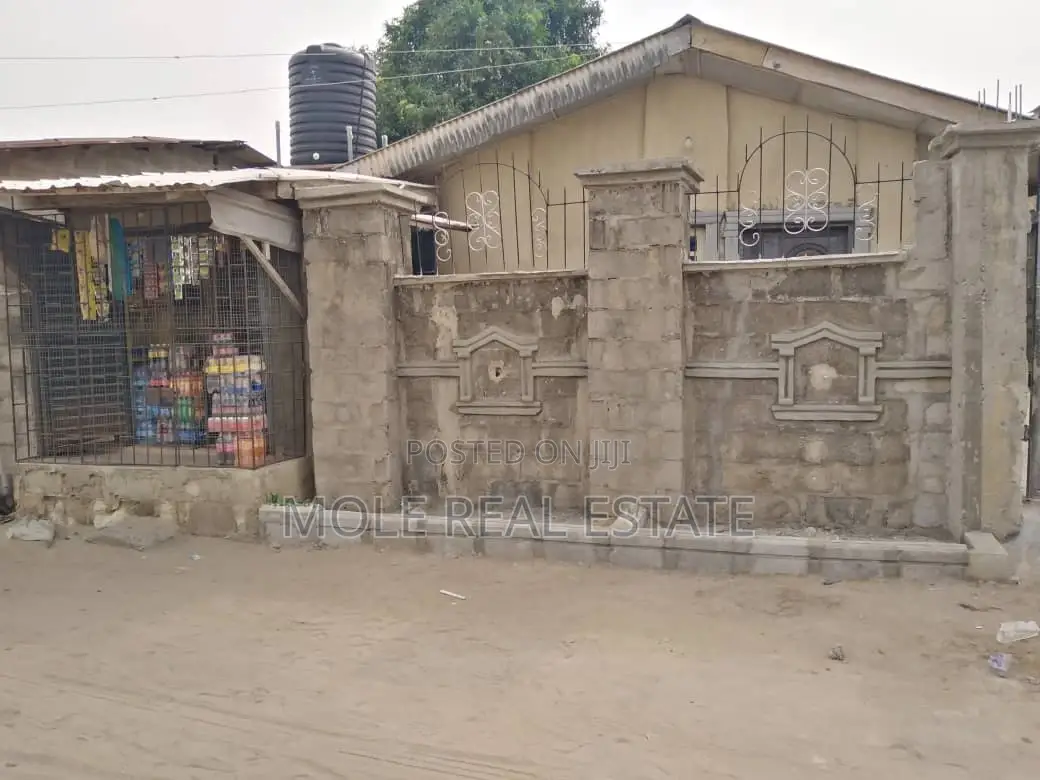 Half Plot at Lanre Iguand New Town Fenced With German DPC in Ikotun/Igando