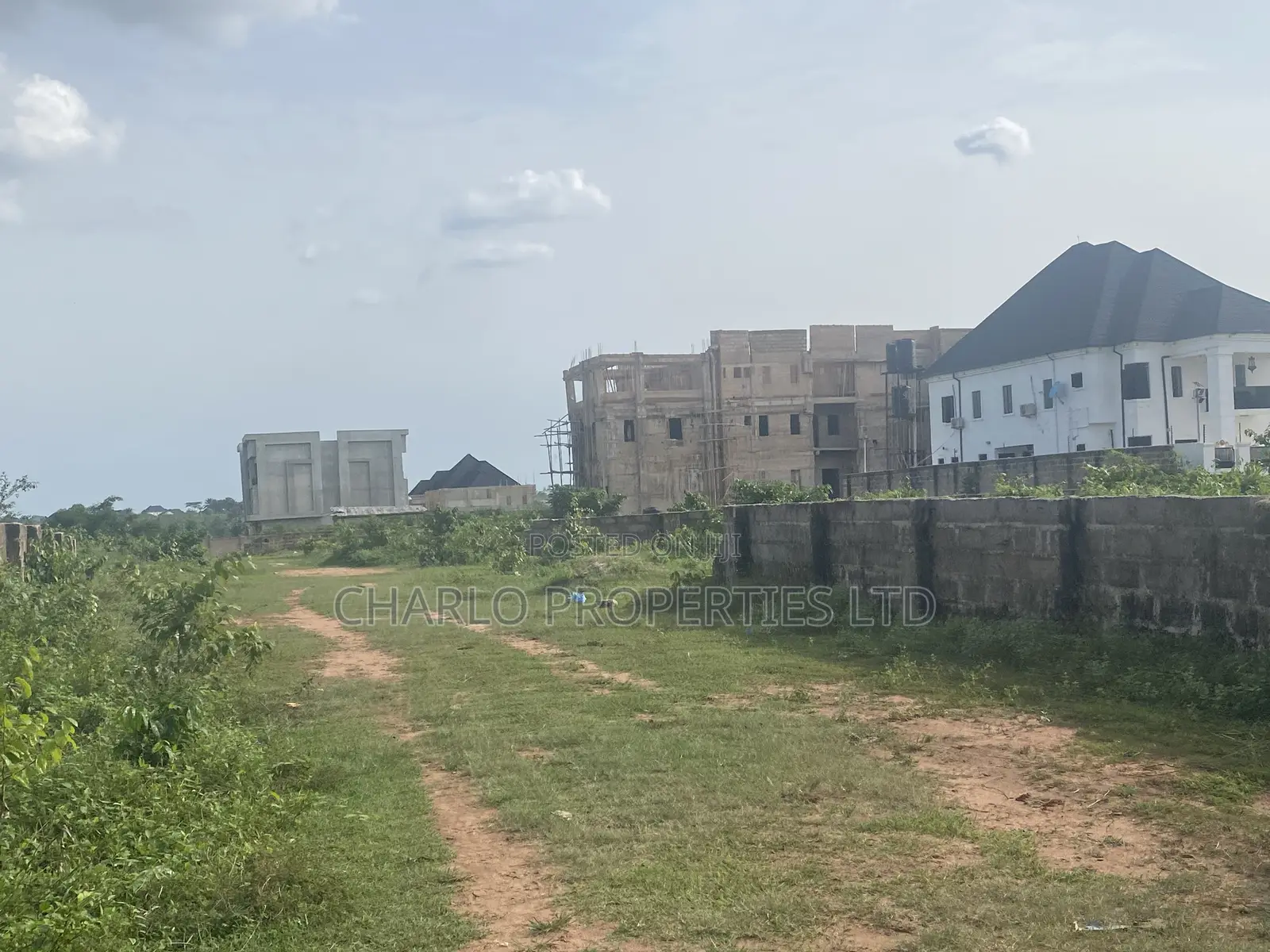 Nice 50ft by 100ft With C of O Fenced Round in Amagba, G.R.A in Benin City