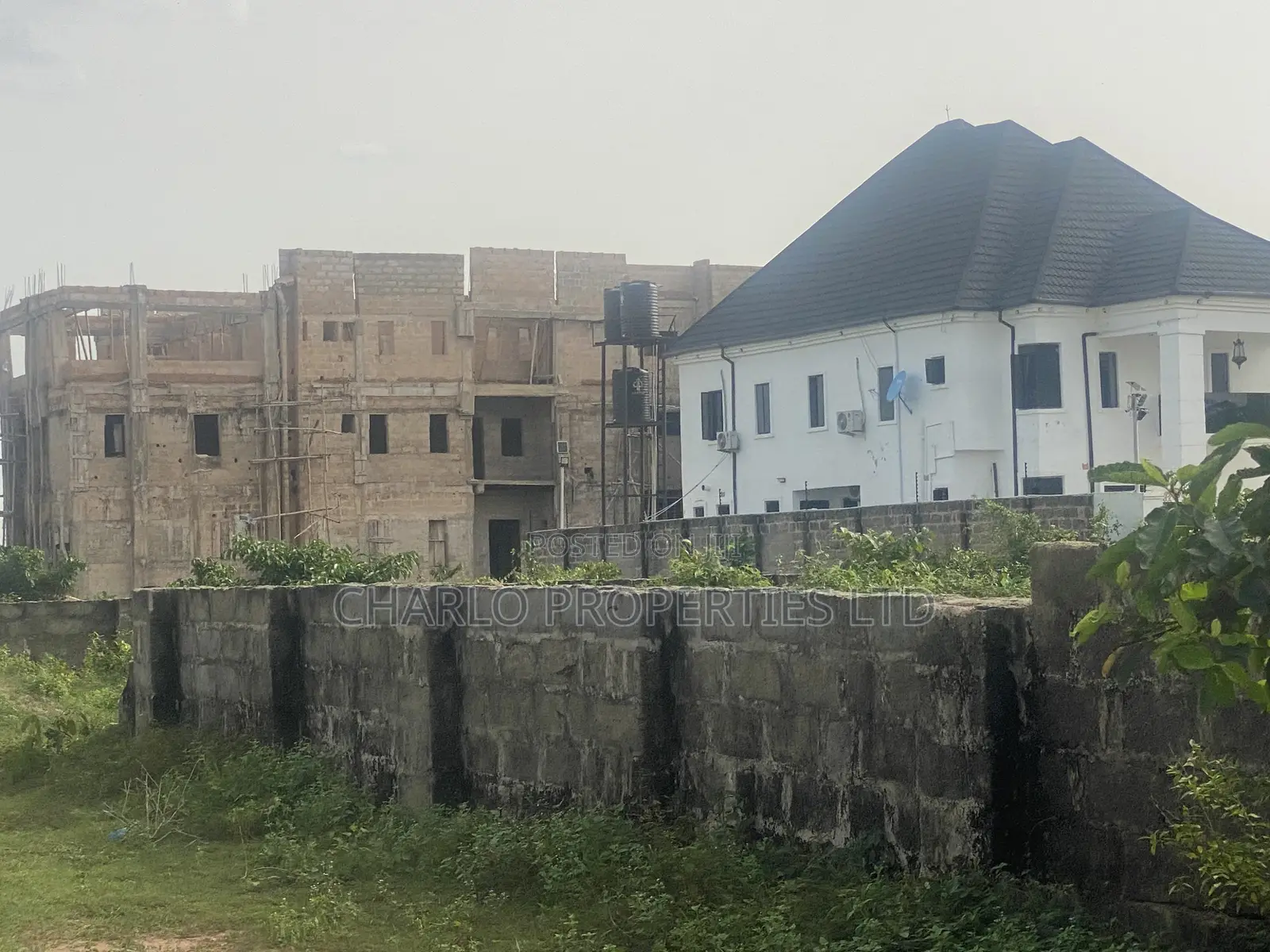 Nice 50ft by 100ft With C of O Fenced Round in Amagba, G.R.A in Benin City