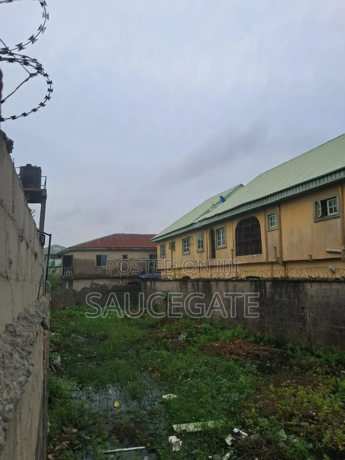 Half Plot Fenced and Gated Dry at Ijegun Satellite Good in Satellite Town
