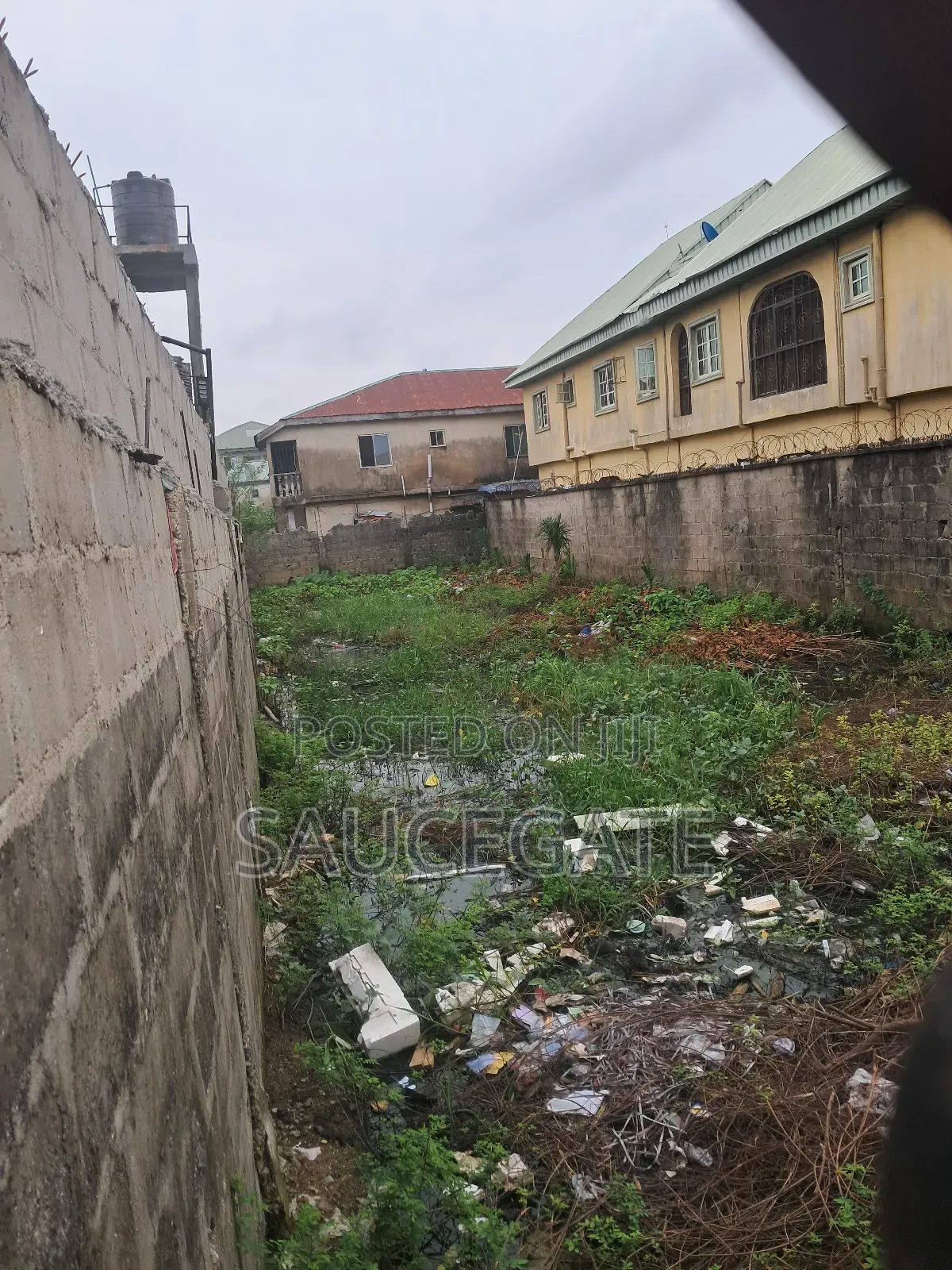 Half Plot Fenced and Gated Dry at Ijegun Satellite Good in Satellite Town
