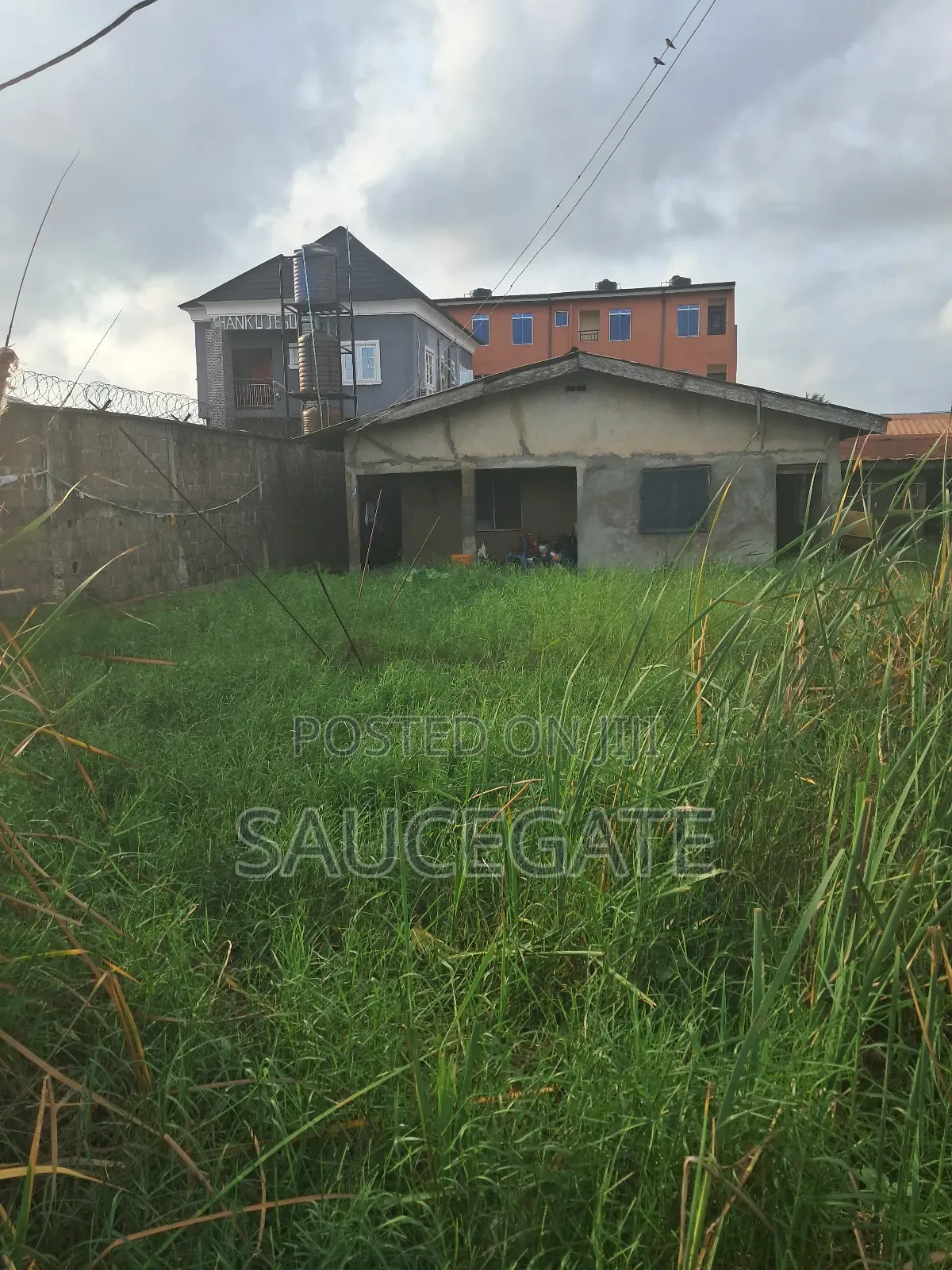 Half Plot for Sale With Old Bungalow at Ijegun Satellite in Satellite Town