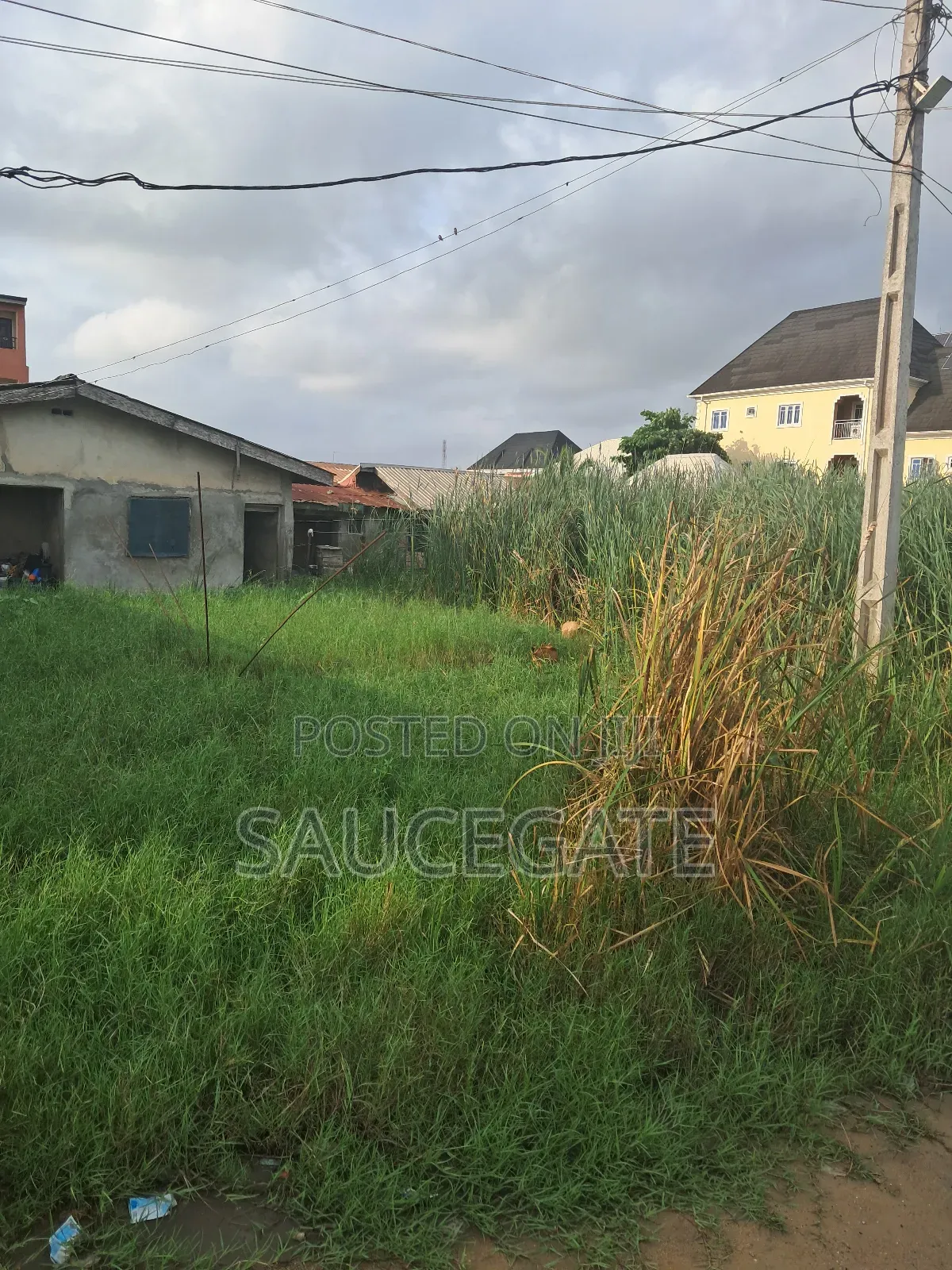 Half Plot for Sale With Old Bungalow at Ijegun Satellite in Satellite Town