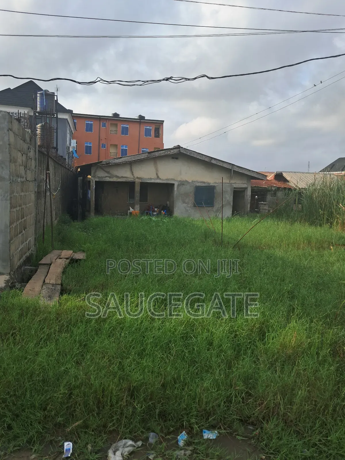 Half Plot for Sale With Old Bungalow at Ijegun Satellite in Satellite Town