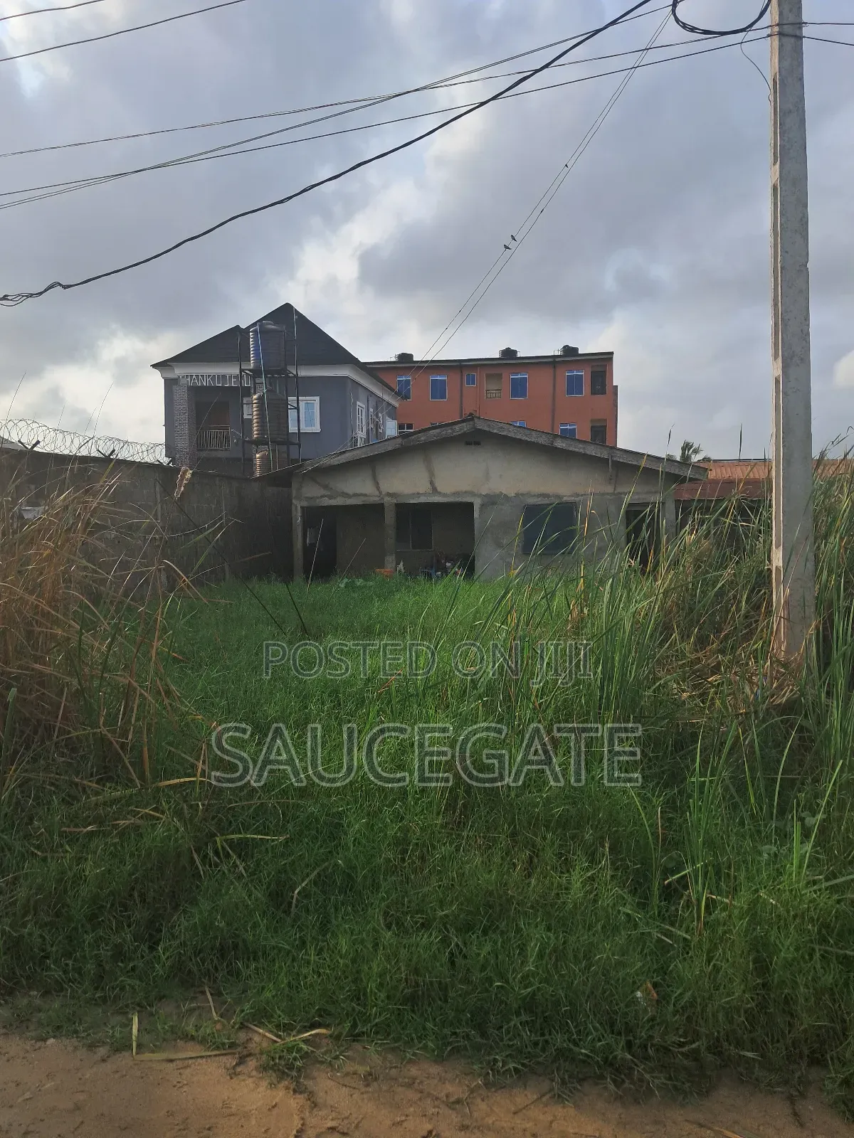 Half Plot for Sale With Old Bungalow at Ijegun Satellite in Satellite Town
