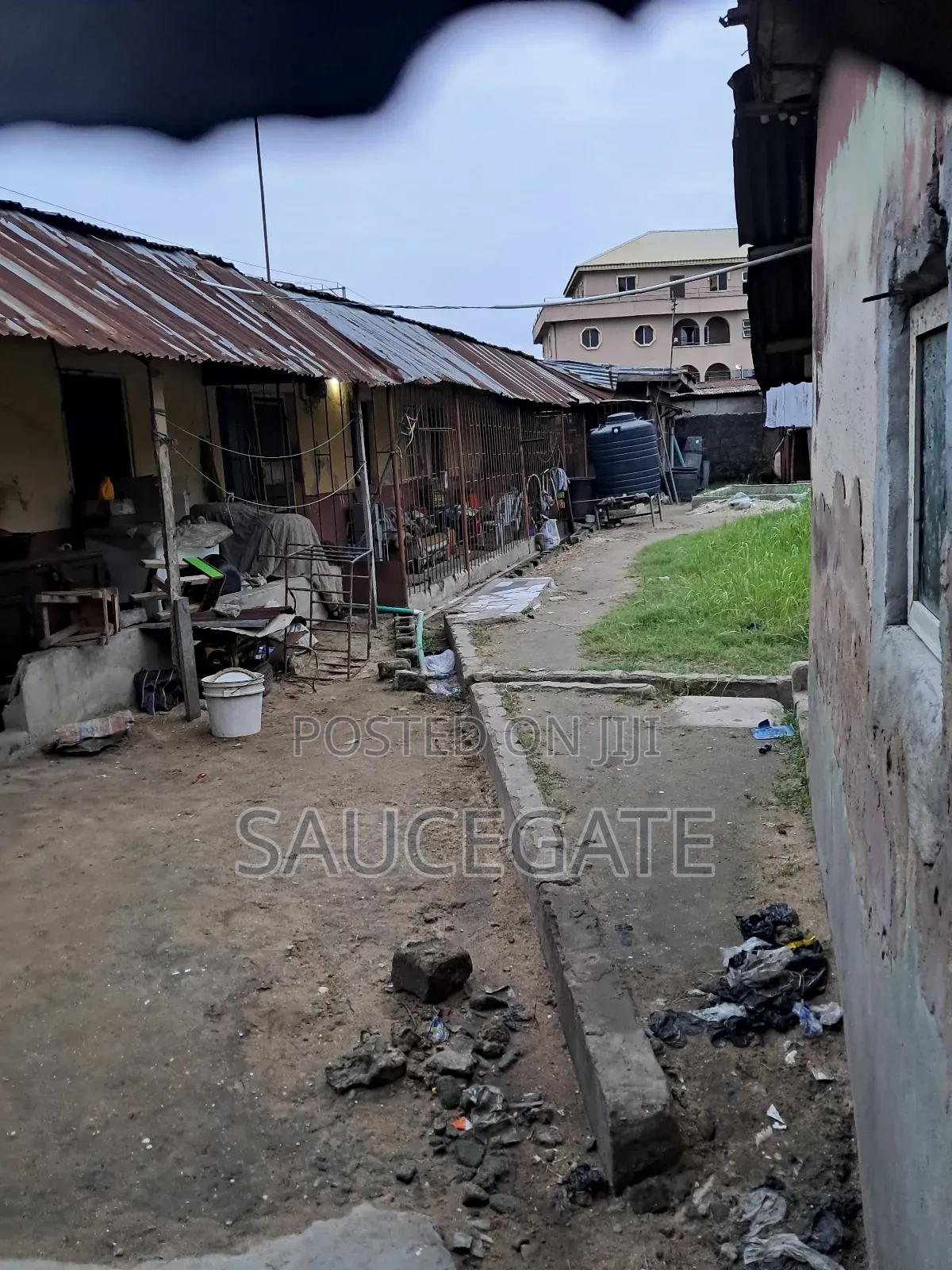 Land Facing a Busy Food Markert at Ijegun in Satellite Town