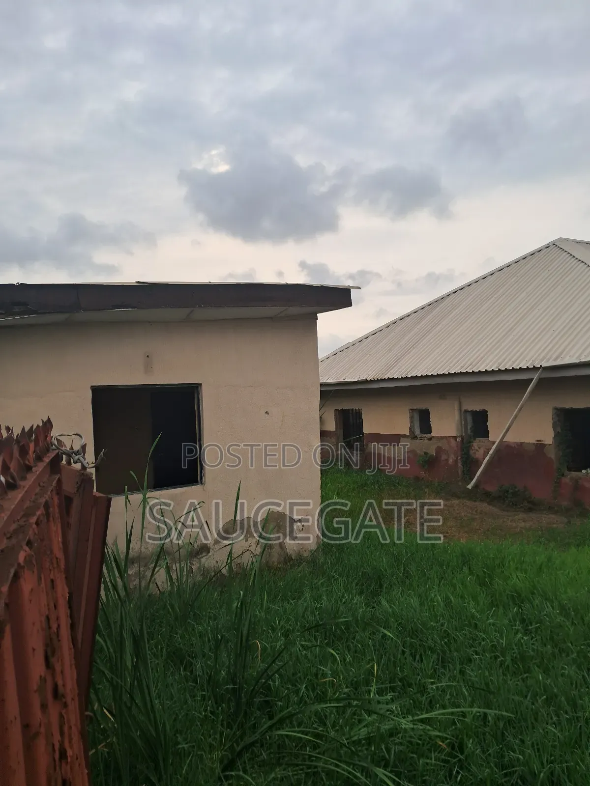 A Land With an Old Demolisbale Building at Ijegun Good Deal in Satellite Town