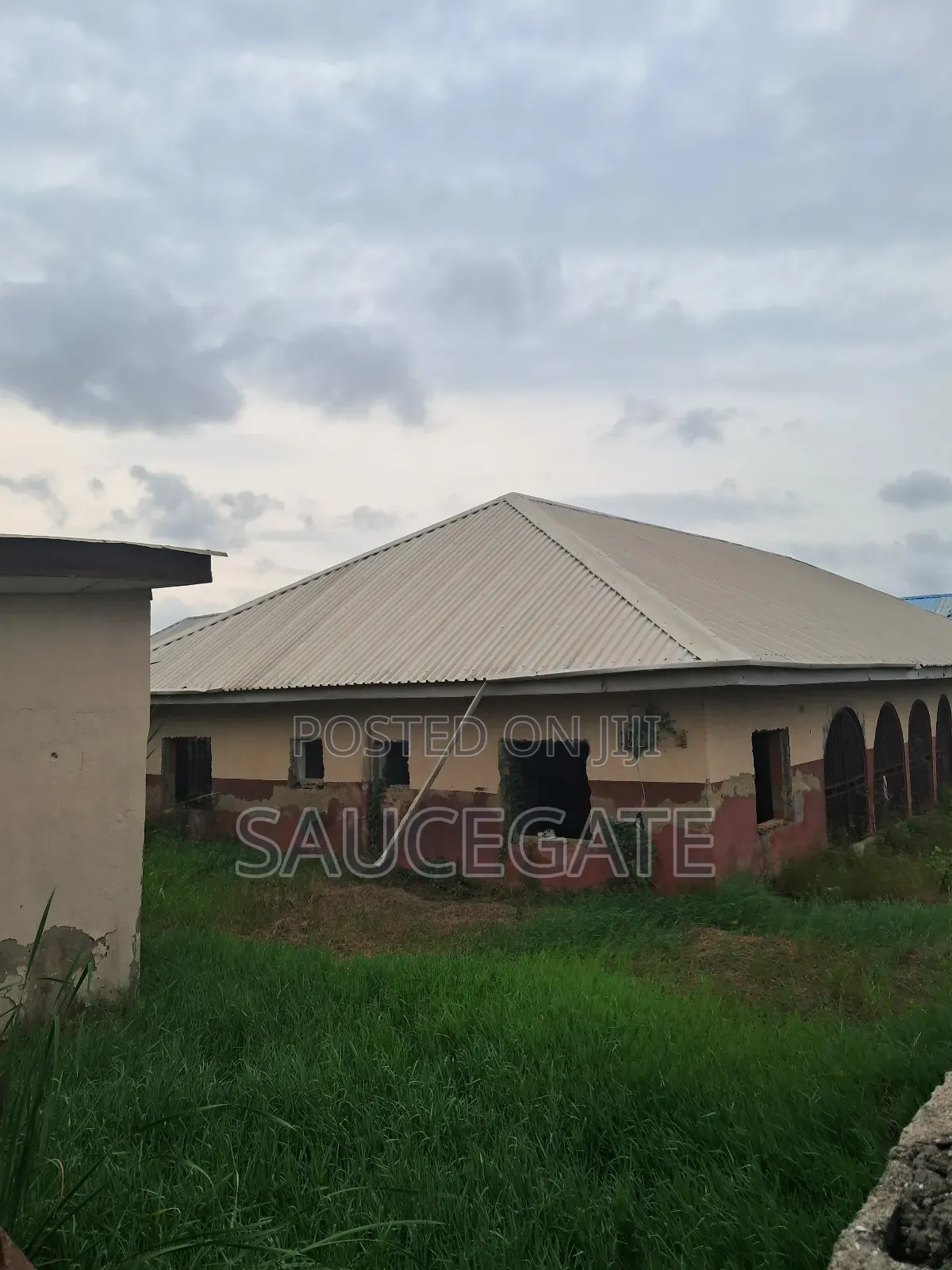 A Land With an Old Demolisbale Building at Ijegun Good Deal in Satellite Town