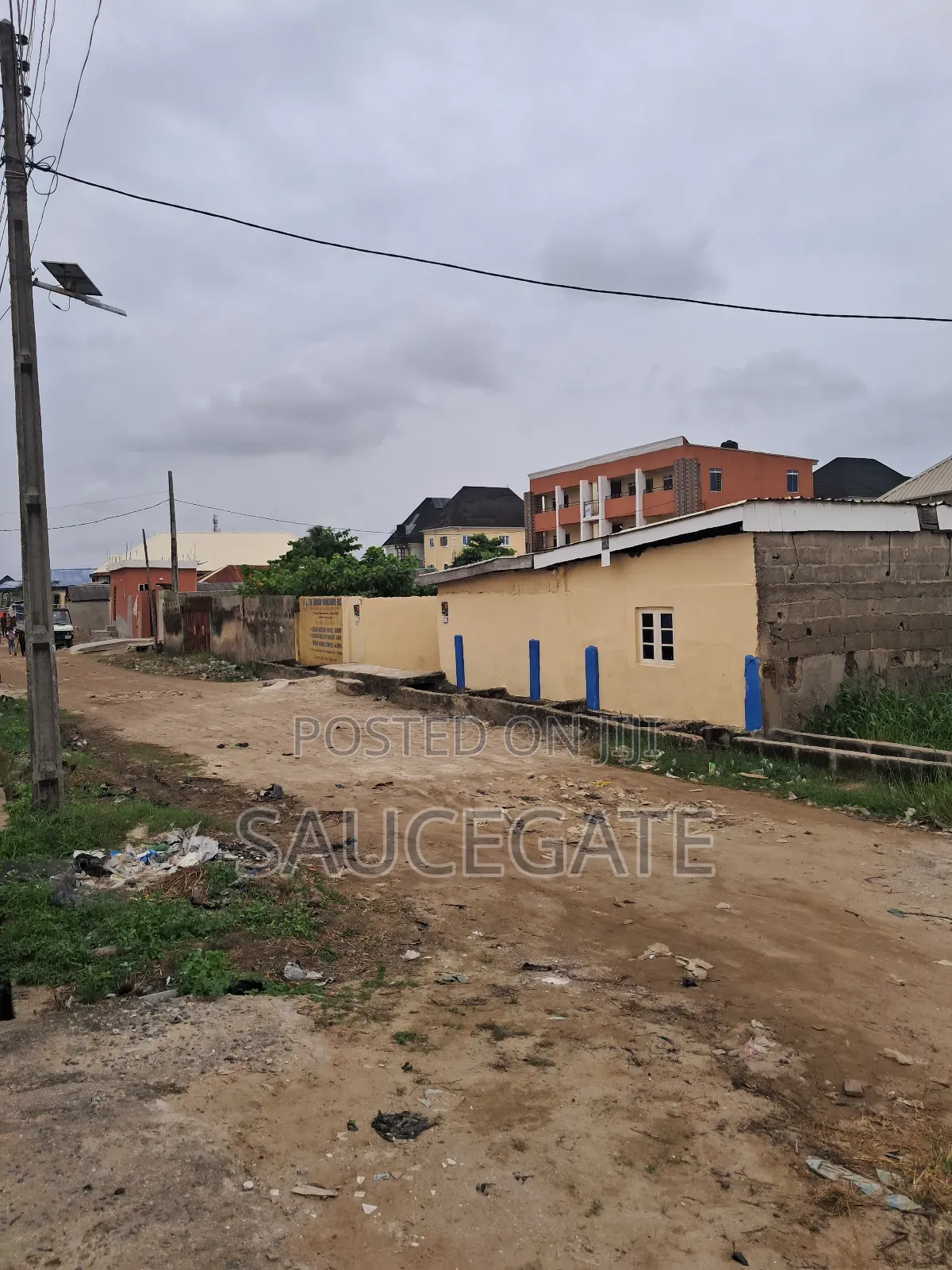 A Land With an Old Demolisbale Building at Ijegun Good Deal in Satellite Town