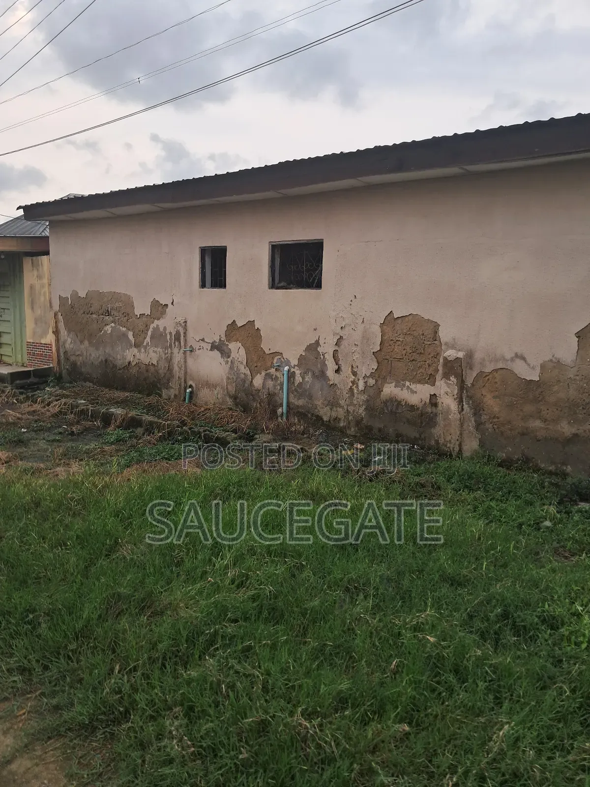 A Land With an Old Demolisbale Building at Ijegun Good Deal in Satellite Town