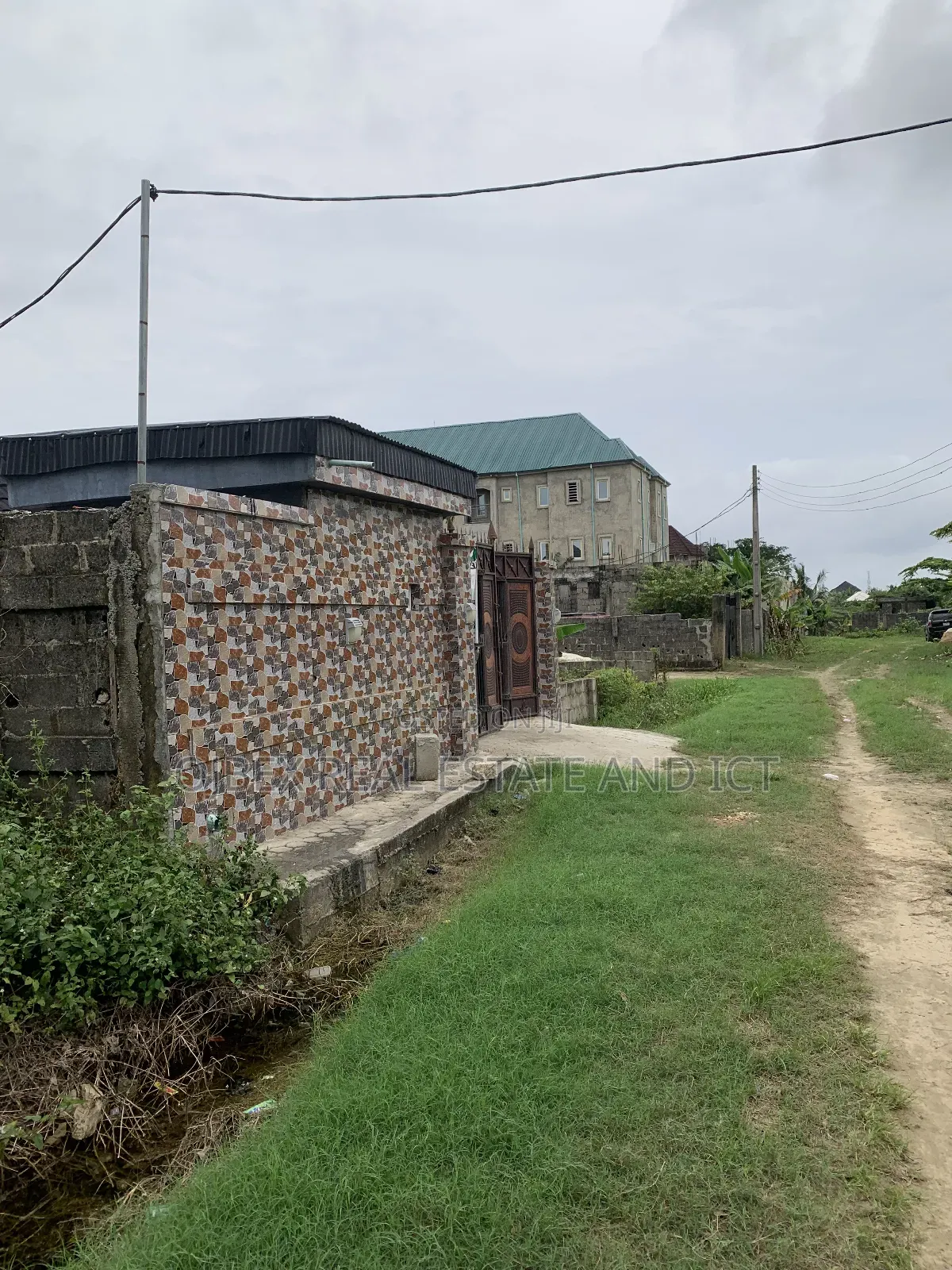 Half Plot of Land With C of O in Ajah