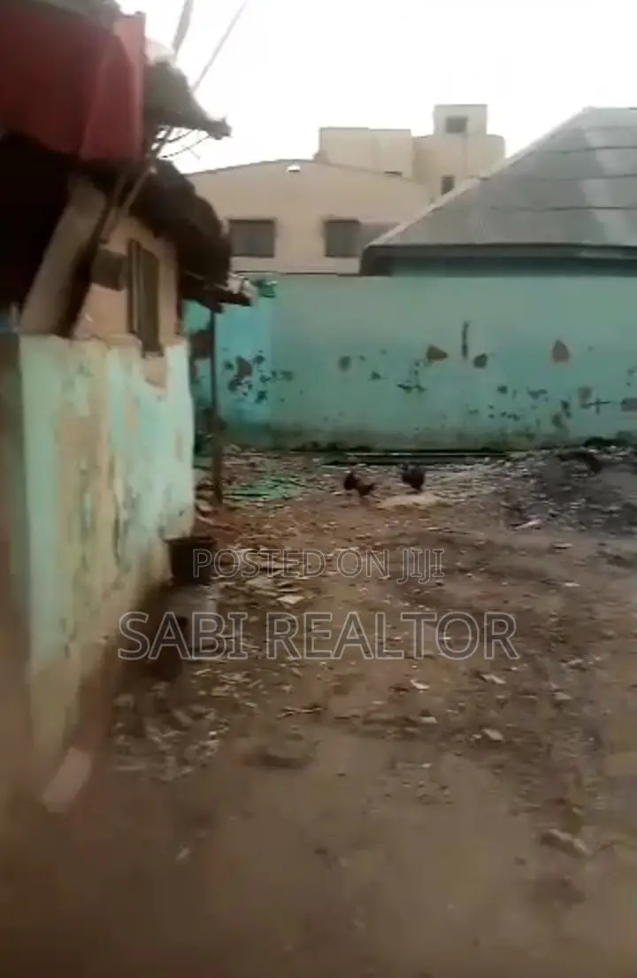 2 Plots of Land With Warehouse and 12 Shops Along a Major Road in Abule Egba