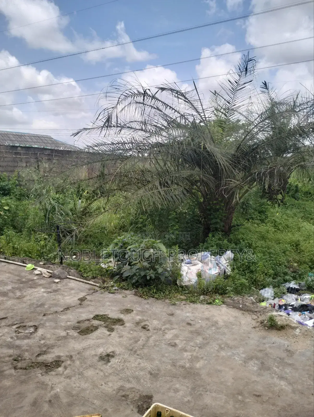 Dry Table Land With 4-Shops at Oluwaga Ipaja Ayobo Lagos in Ipaja