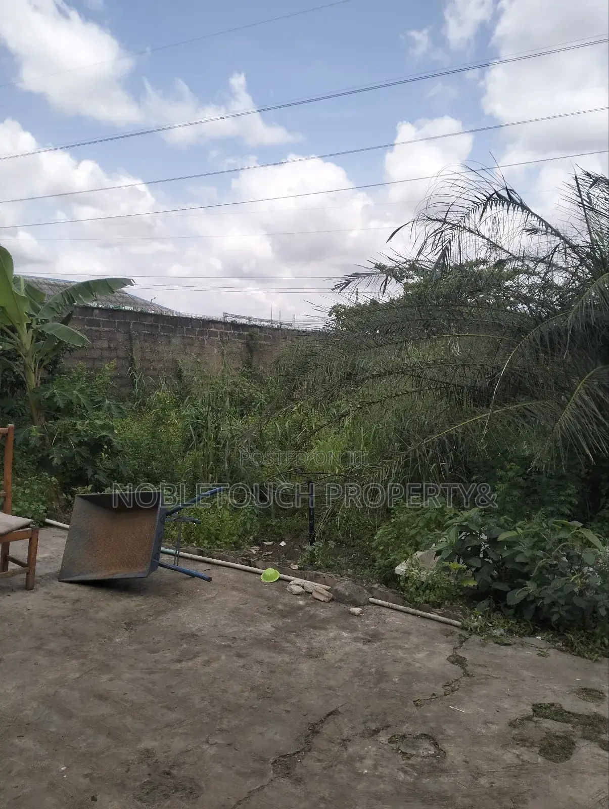 Dry Table Land With 4-Shops at Oluwaga Ipaja Ayobo Lagos in Ipaja