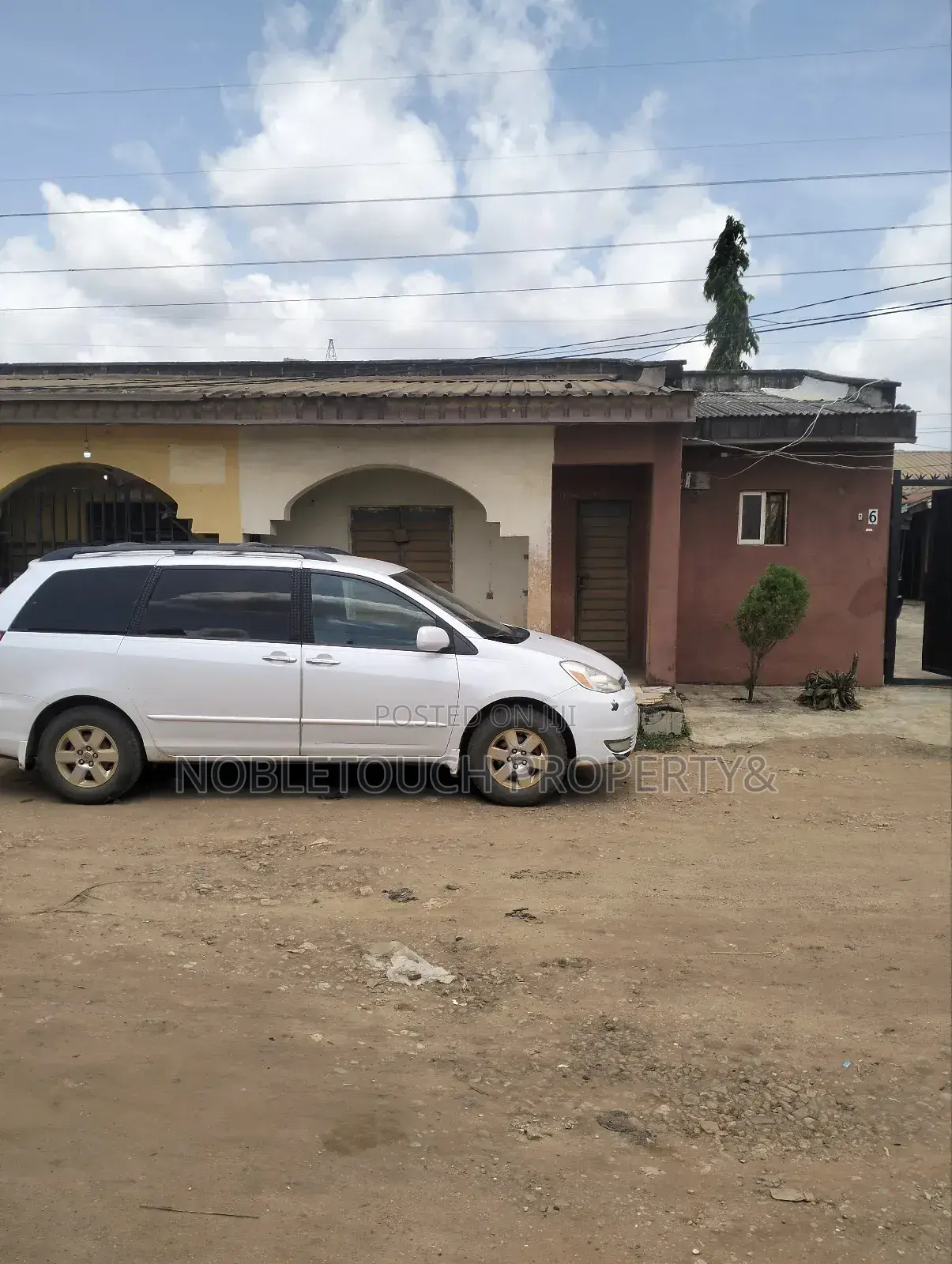 Dry Table Land With 4-Shops at Oluwaga Ipaja Ayobo Lagos in Ipaja