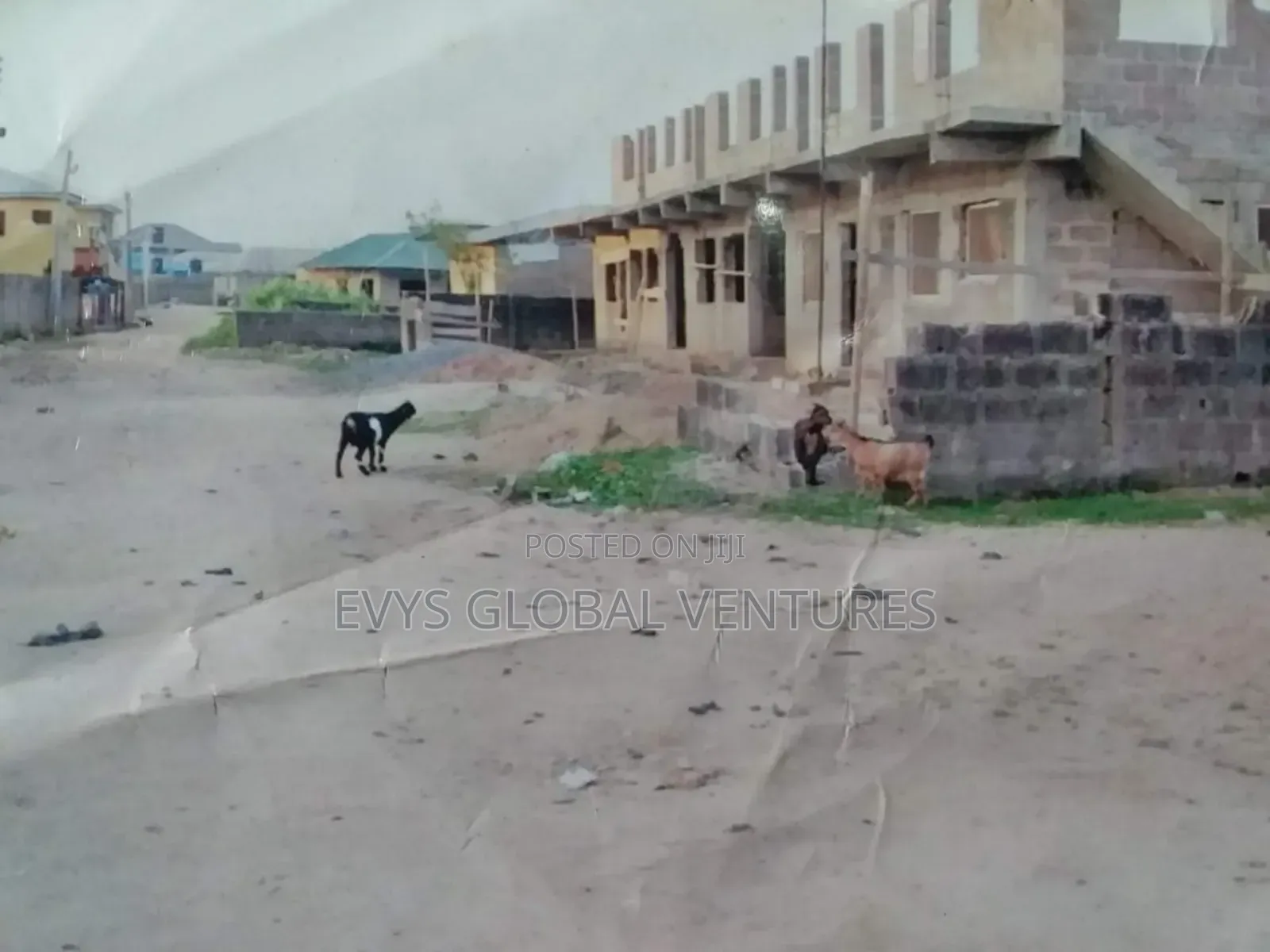 A 60 by 120 Full Plot of Land With a Building in Obafemi-Owode