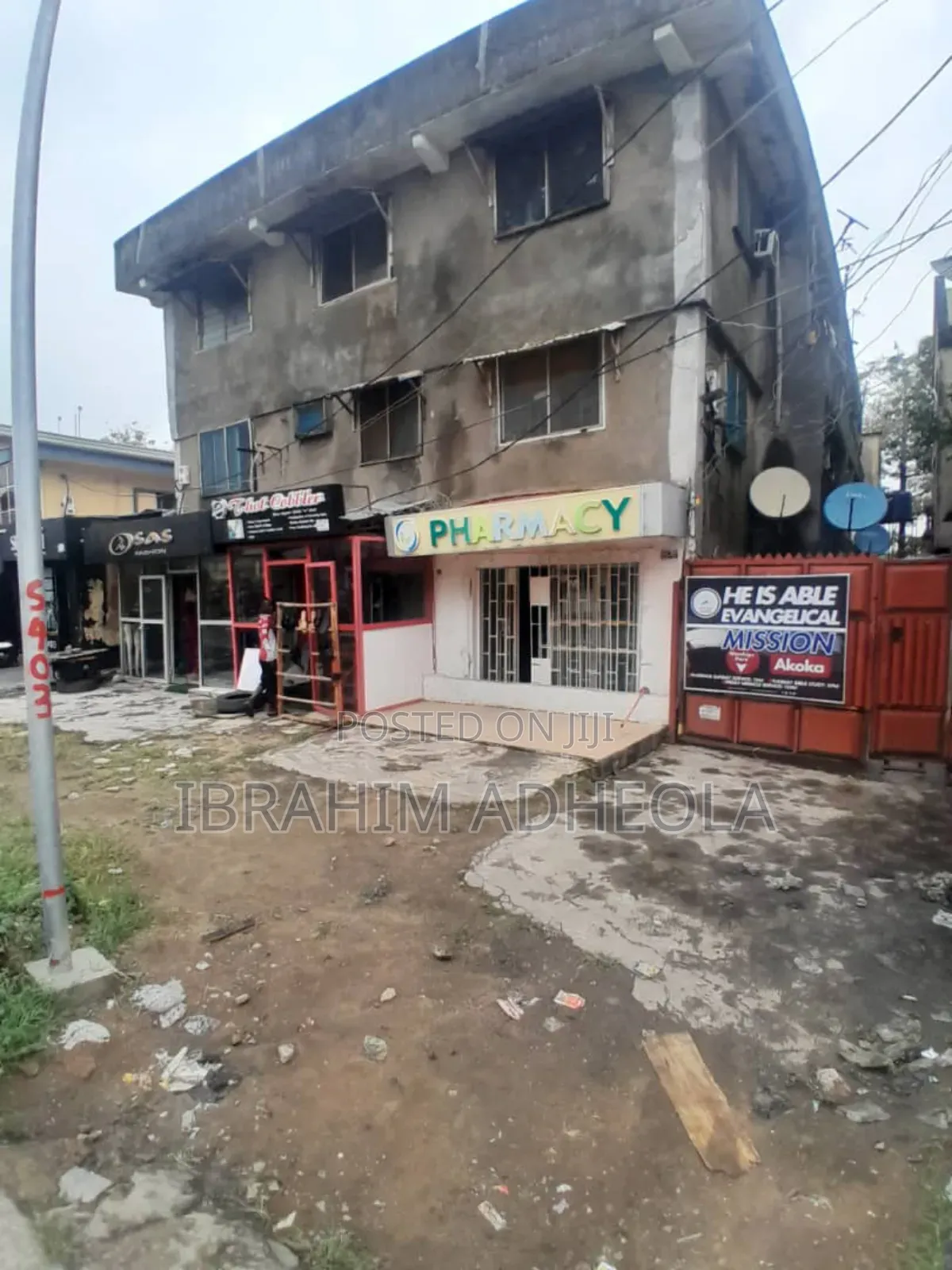 A Land With Commercial Building in Akoka