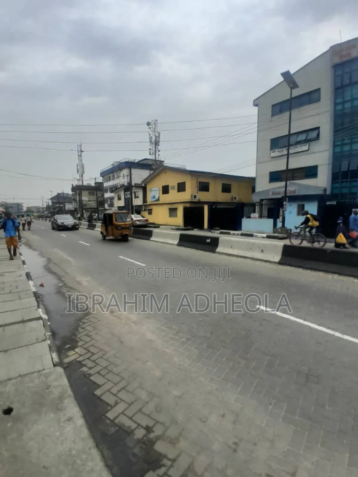 A Land With Commercial Building in Akoka