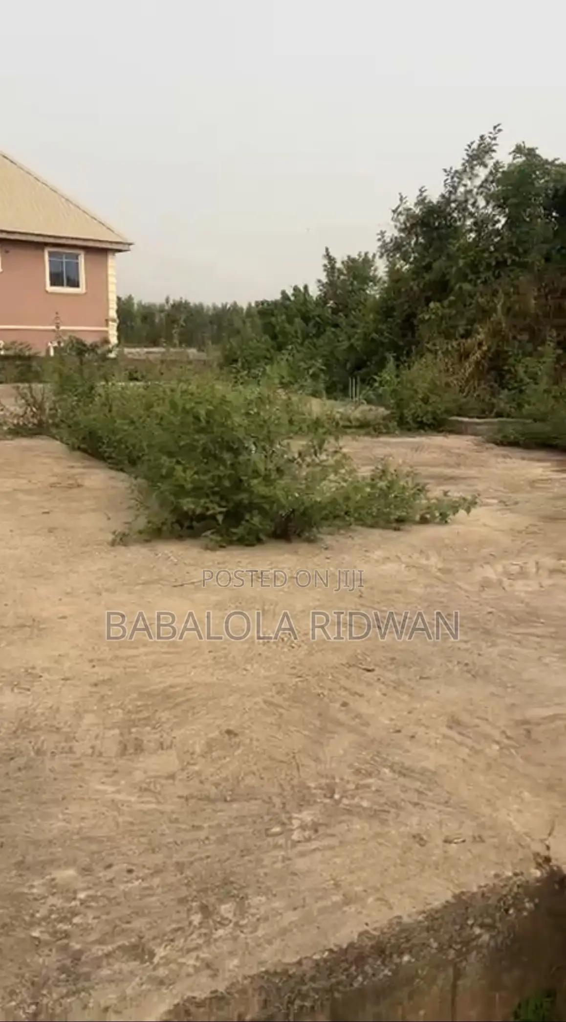A Standard Full Plot of Land With German Floor in Akala Express