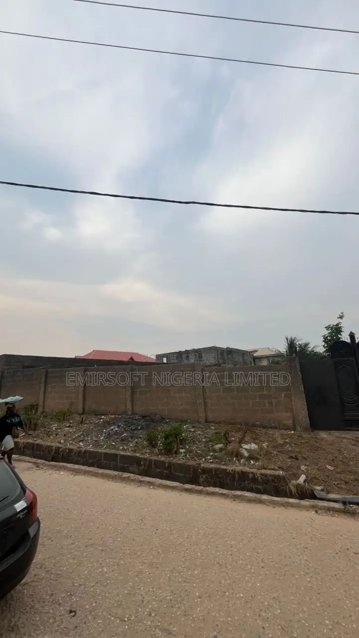 A Fenced and Gated Commercial Land Opposite I-Cast School, Elebu in Akala Express