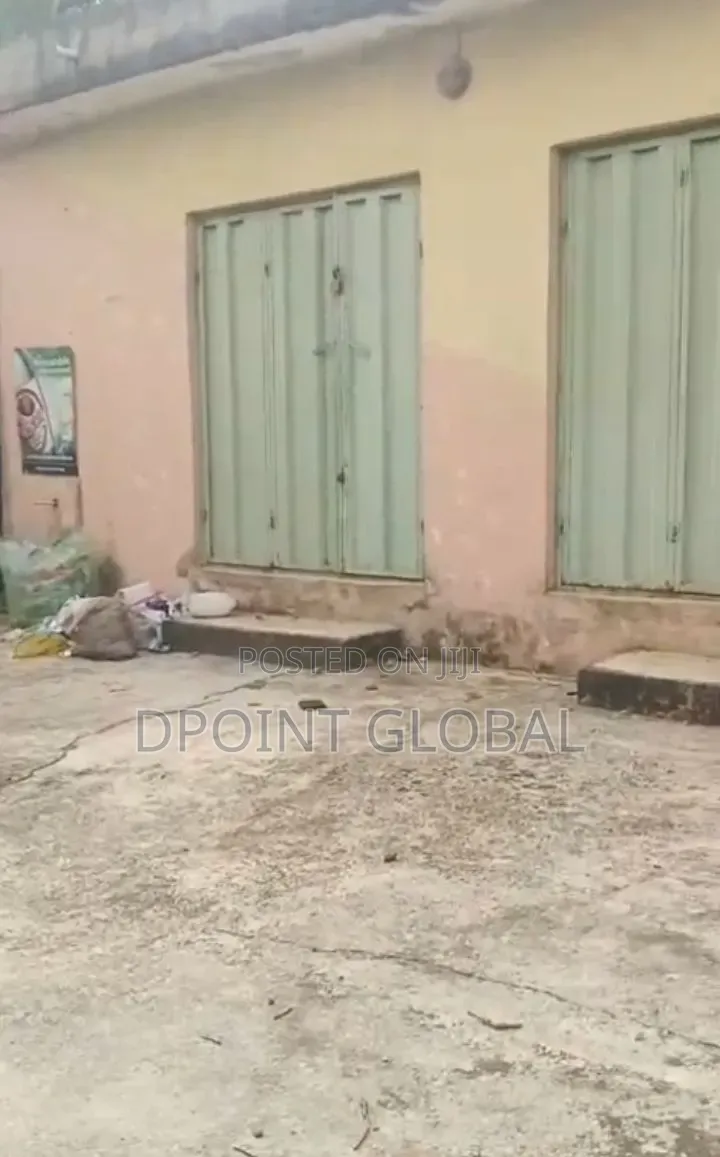 More Than Half Plot With Big Shops in Ayobo