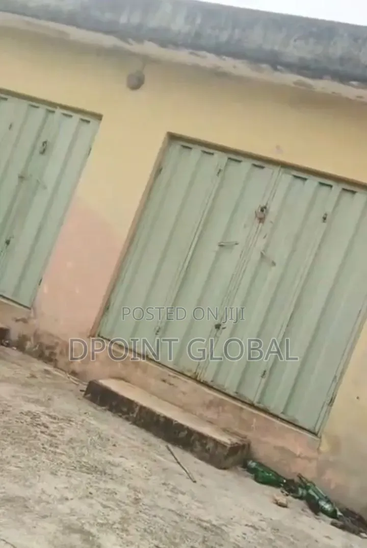More Than Half Plot With Big Shops in Ayobo