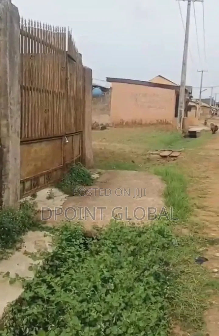 More Than Half Plot With Big Shops in Ayobo
