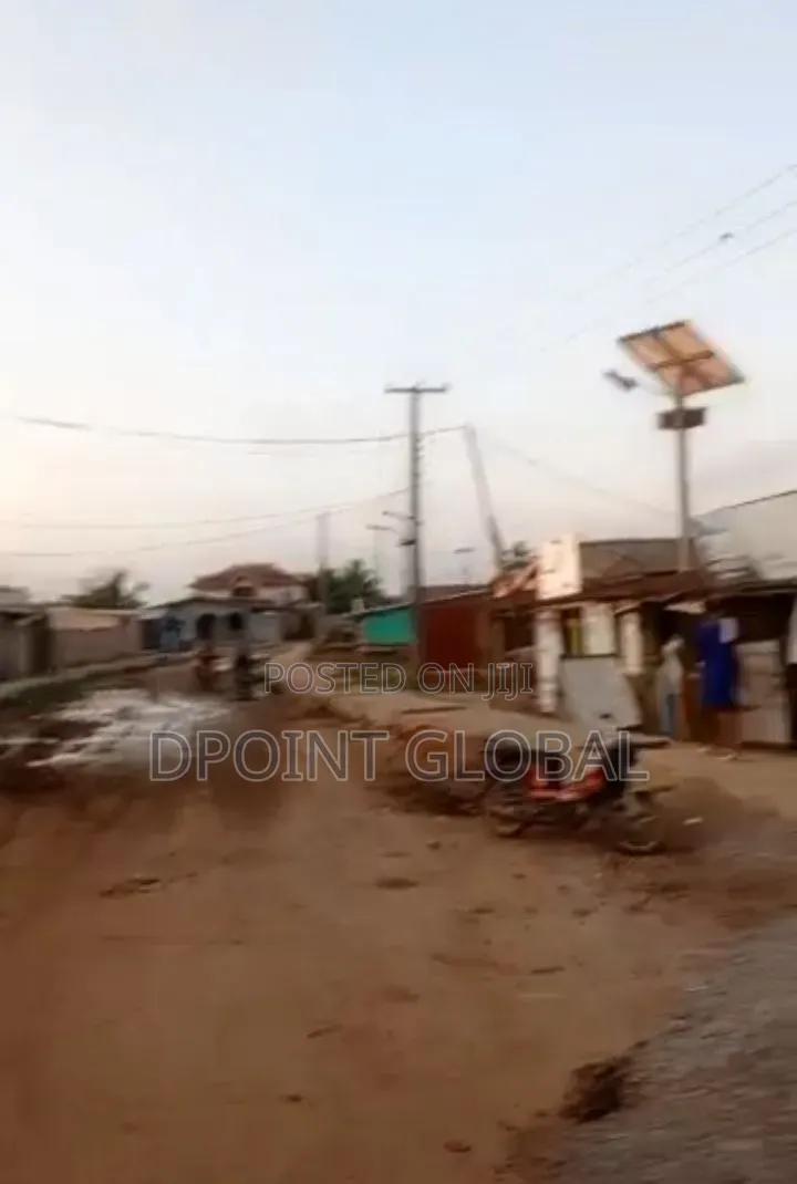Half Plot of Land With Shops , Facing Road Construction in Ayobo in Ayobo