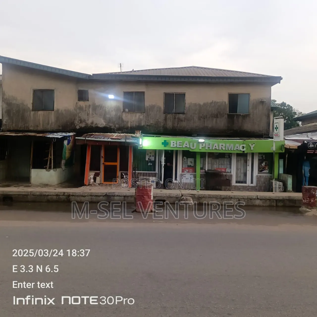 Property Having 21 Room and a Parlour Plus Shops for Sale.Along NNPC in Ejigbo / Ejigbo