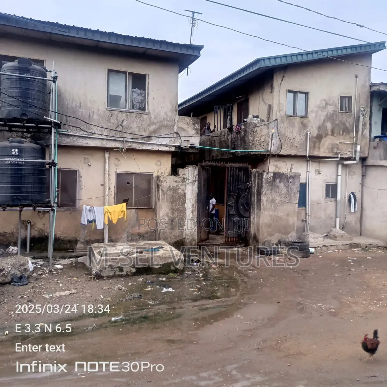 Property Having 21 Room and a Parlour Plus Shops for Sale.Along NNPC in Ejigbo / Ejigbo
