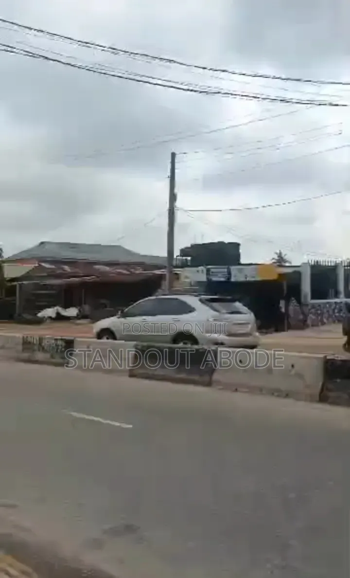 Half Plot of Land With Demolishable Building Facing Ekoro Road in Abule Egba