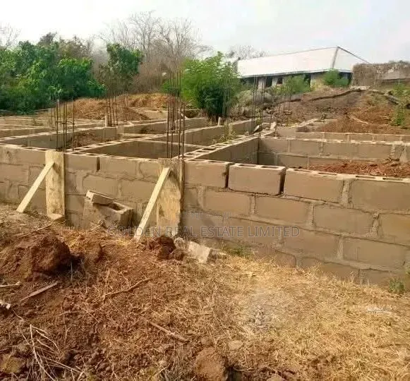 A Plot of Land With 10 Rooms Self Contain at Foundation Level in Oye