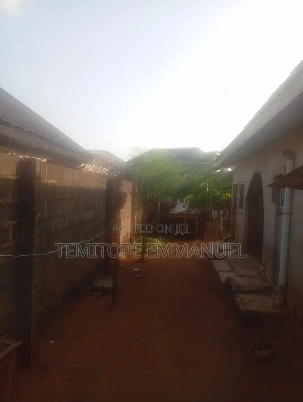 Half Plot of Land Fenced on a Major Road in Abule Egba