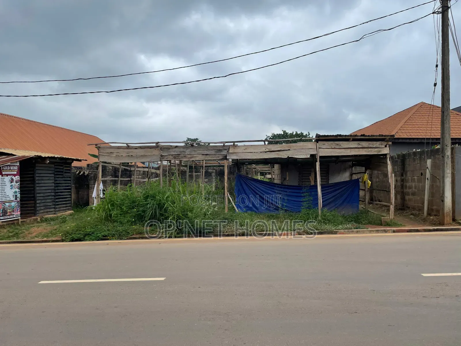A Plot of Land With an Uncompleted Building Facing a Major Road in Akure
