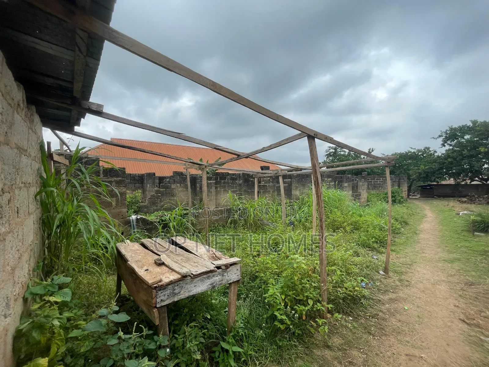 A Plot of Land With an Uncompleted Building Facing a Major Road in Akure