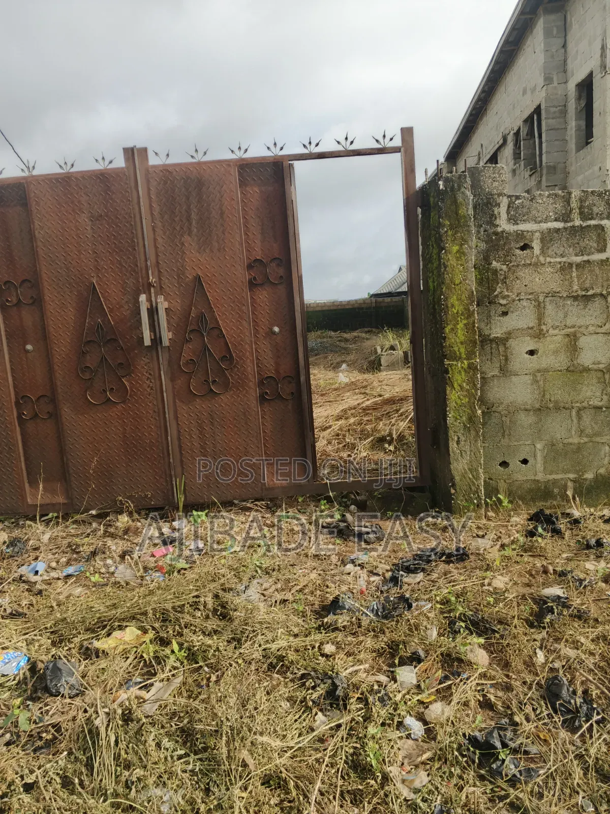 Half Plot of Land Fence Gated Very Close to the Tarred Road in Ayobo