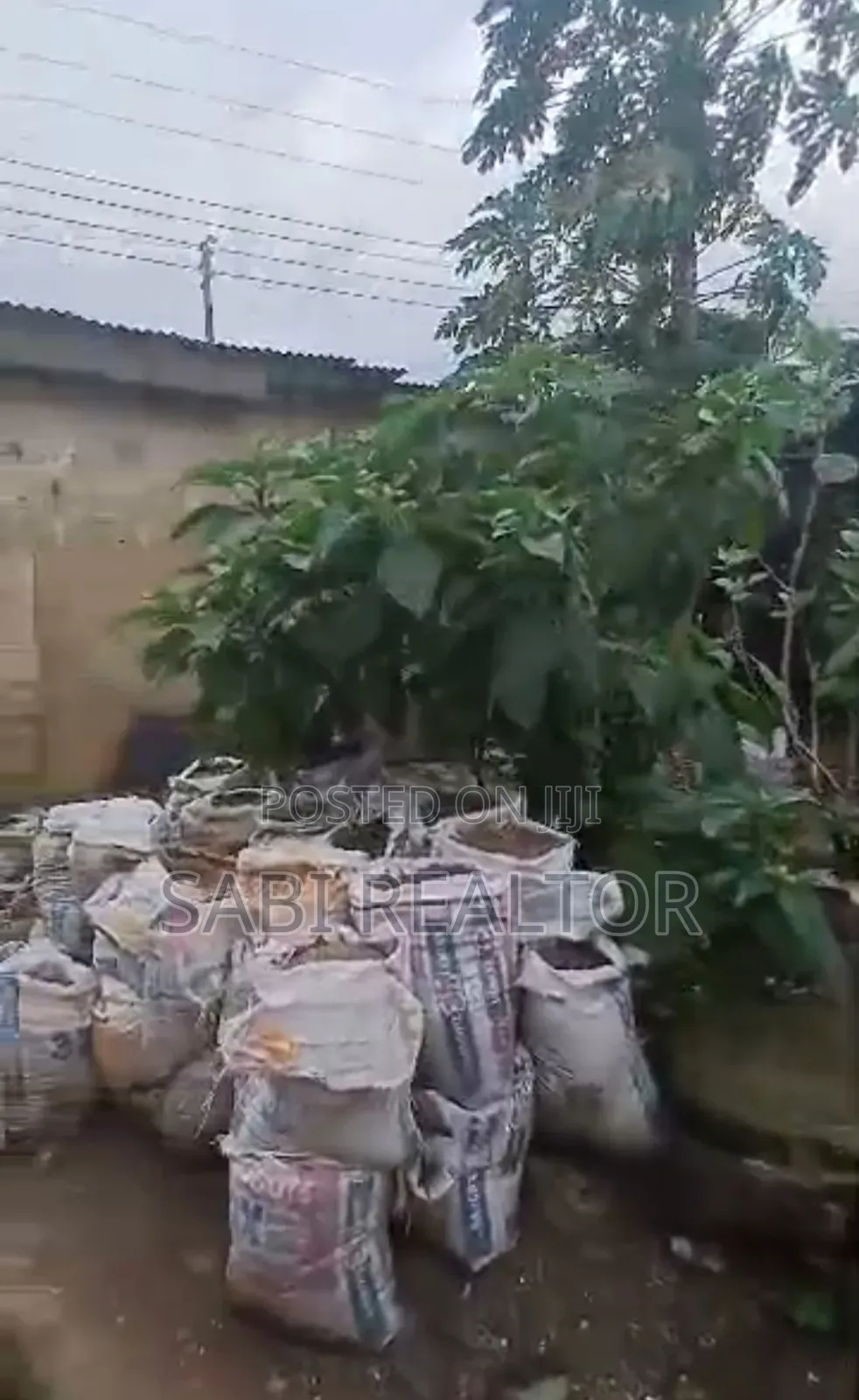 Full Plot of Land With 7 Shop at Adefemi Junction Ipaja Lagos in Ipaja Road