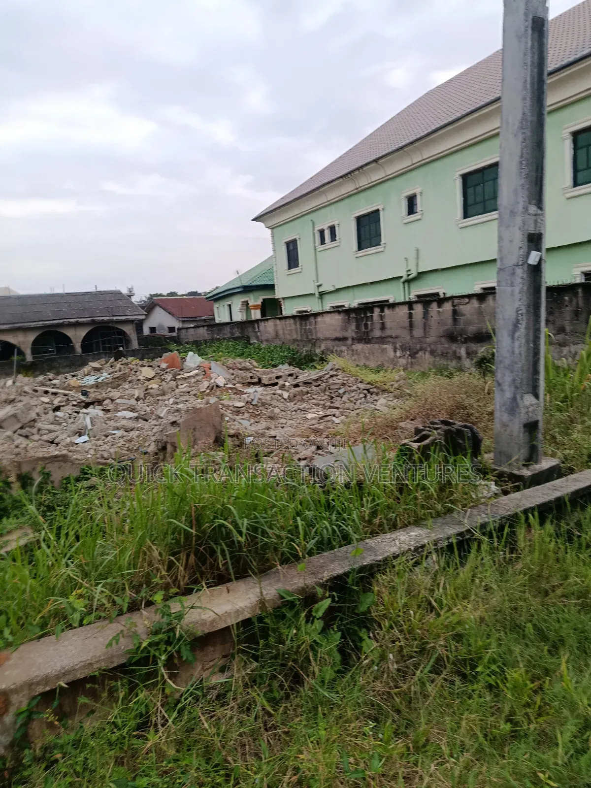Dry half.plot of Land Fenced Round on a Corner Piece in Bucknor