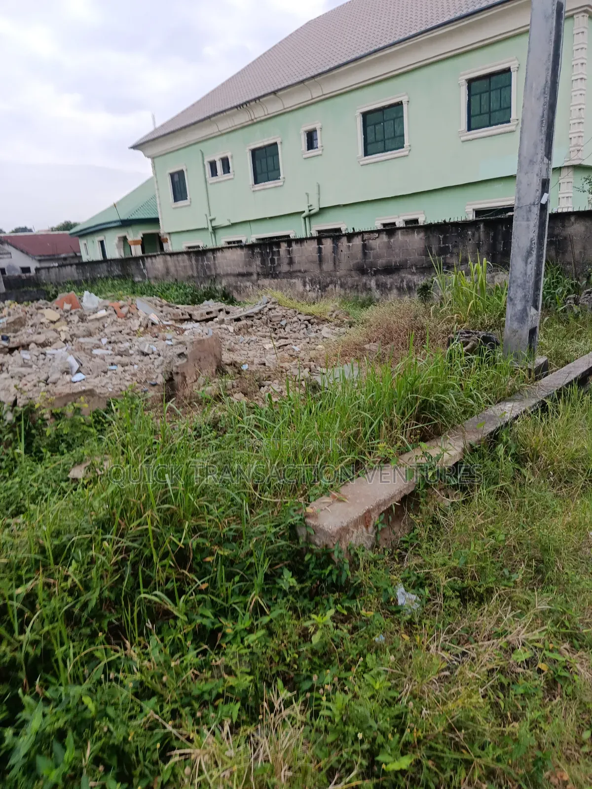 Dry half.plot of Land Fenced Round on a Corner Piece in Bucknor
