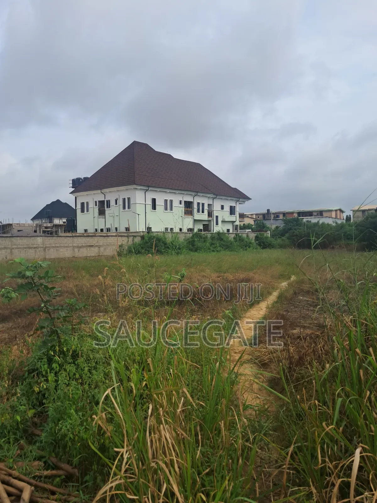 Dry Land at SatelliteTown Nasxo Estate Global C of O No Omonile in Satellite Town