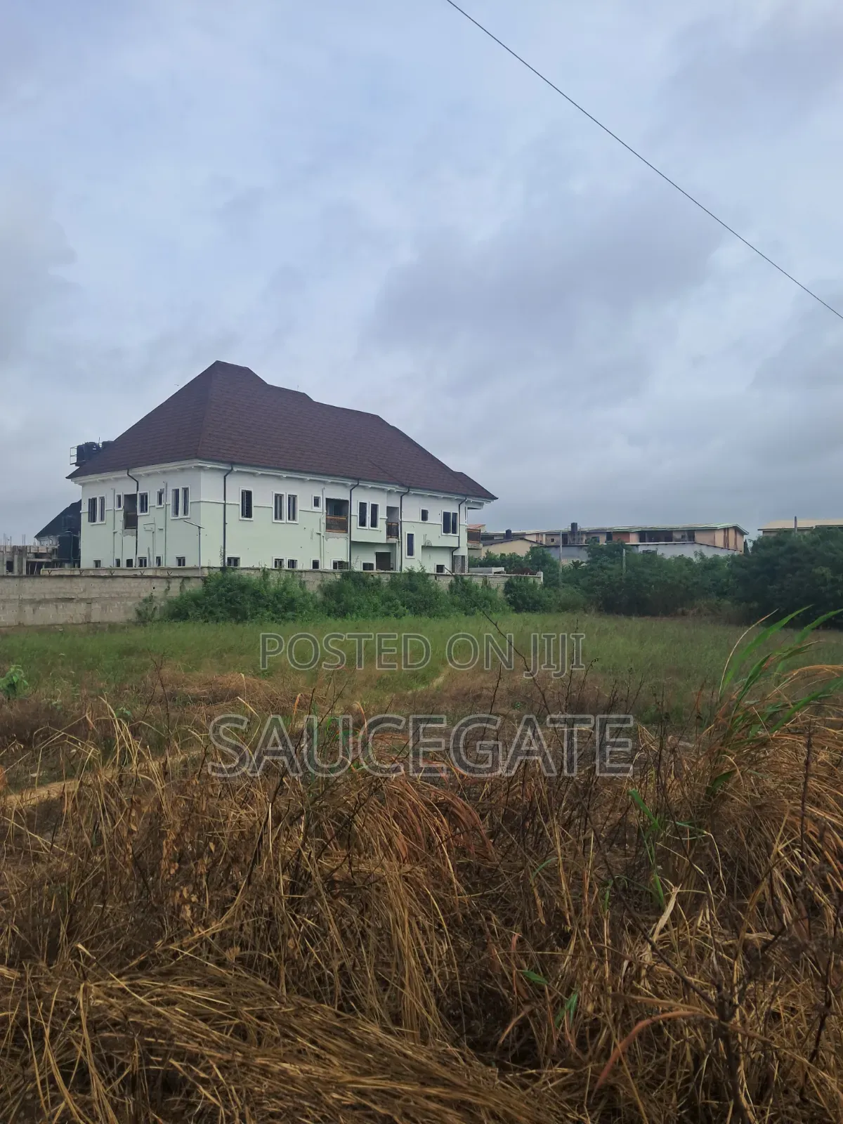 Dry Land at SatelliteTown Nasxo Estate Global C of O No Omonile in Satellite Town