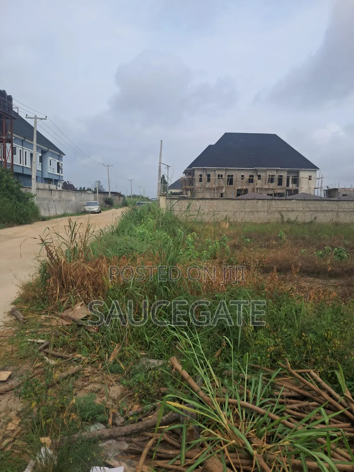 Dry Land at SatelliteTown Nasxo Estate Global C of O No Omonile in Satellite Town