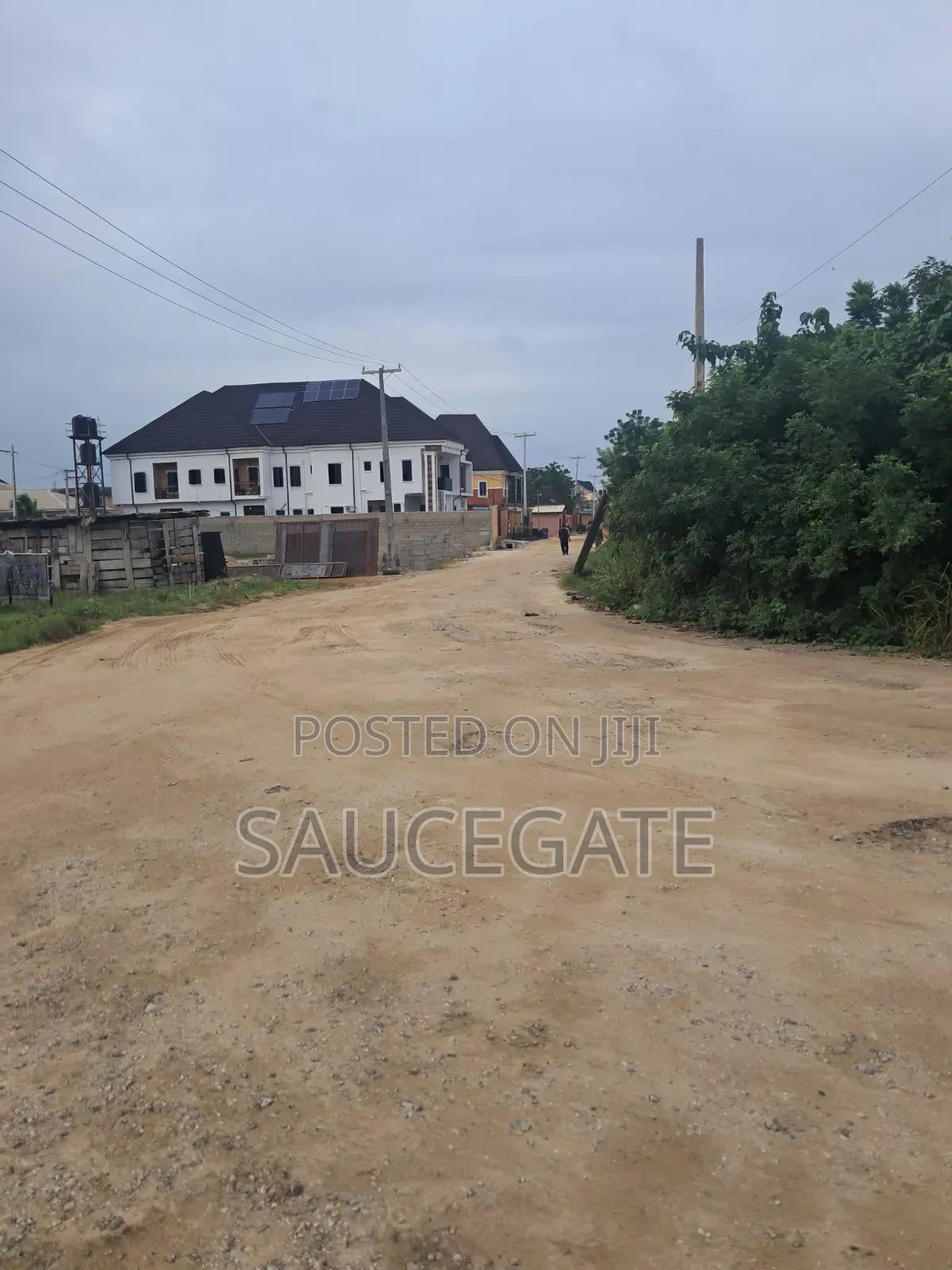 Dry Land at SatelliteTown Nasxo Estate Global C of O No Omonile in Satellite Town
